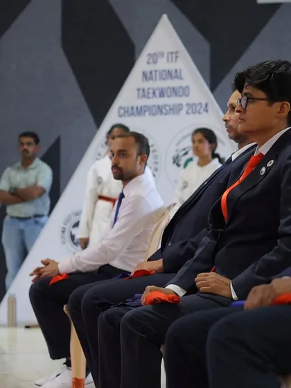 Seated with the officiating panel at the National Taekwon-Do Championship. Maintaining composure and focus is essential, both as a competitor and as a judge.