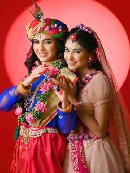 A joyful portrait of Radha and Krishna for Janmashtami. Their bright smiles and colorful attire capture the divine and playful spirit of their eternal love story.