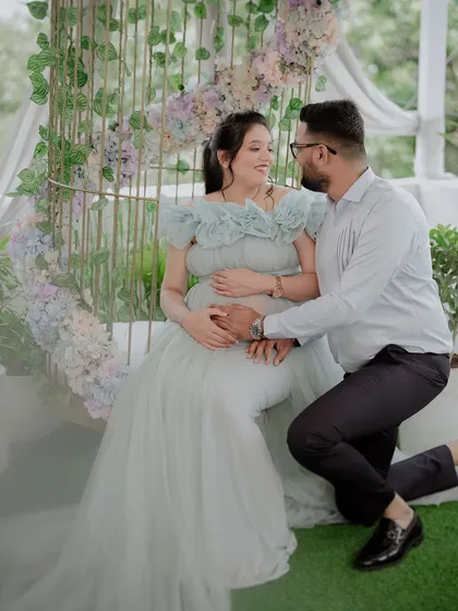This is for all my mommies-to-be. This beautiful image captures such a tender moment, and our light blue gown is designed to be both comfortable and elegant, perfectly draping over your baby bump. The front slit is a thoughtful detail to beautifully highlight your belly.