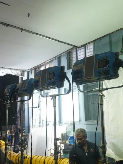 A lineup of ARRI M-Series lights in a studio setting. These powerful HMI fixtures are an industry standard for simulating hard sunlight.