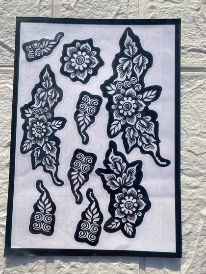 A collection of floral and paisley stencil pieces. These smaller elements are perfect for decorating fingers or creating custom patterns.