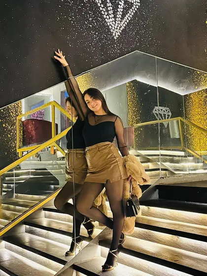A powerful pose on the stairs, showing confidence and style.