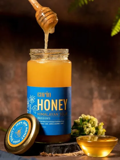 Action shots bring a product to life. Capturing this thick, golden honey as it drips from the dipper creates a dynamic and mouth-watering image that communicates the product's quality and natural texture.