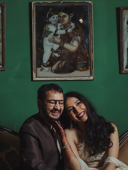 A happy couple shares a laugh, their casual pre-wedding outfits perfect for a relaxed photoshoot at our venue.