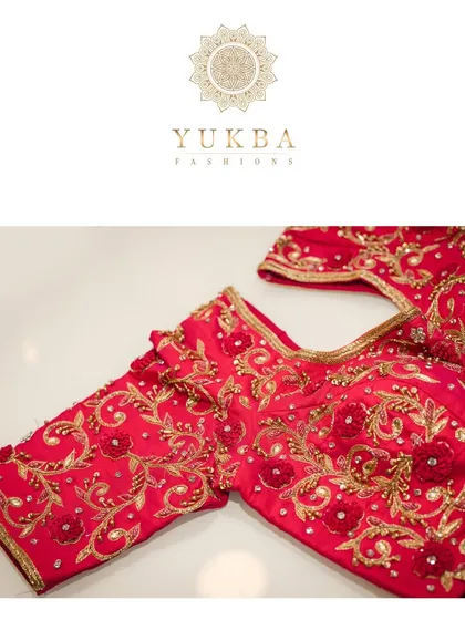 A close-up of a classic red bridal blouse. This image shows the detailed 3D floral embroidery and gold threadwork, a testament to the hours of craftsmanship involved in creating a single piece.