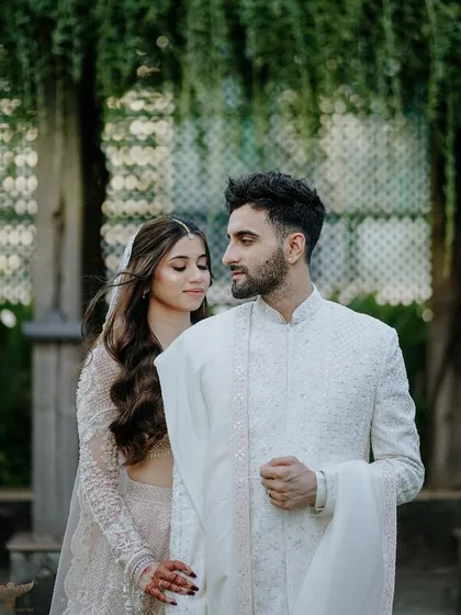 A close, intimate portrait that focuses on the gentle connection between the couple. The soft, natural light and the elegance of their traditional attire come together to create a timeless and romantic pre-wedding photograph.