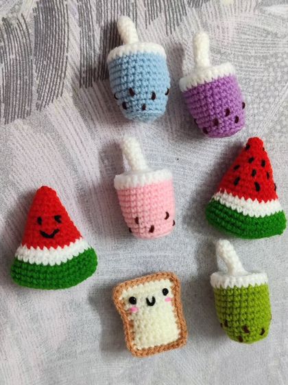 Add some fun to your kitchen with these adorable food-themed fridge magnets. This set includes boba tea, watermelon slices, and a cute slice of bread, all handmade with crochet.