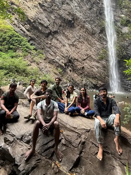 The group relaxing by the Koodluthirtha Falls, a perfect spot to cool off.