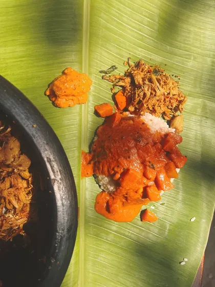 A perfect bite of the Vishu feast. Fluffy red rice topped with Pumpkin Pulinkari, alongside Jackfruit Thoran and a dollop of Mambazha Pachadi, a symphony of sweet, sour, and savoury.