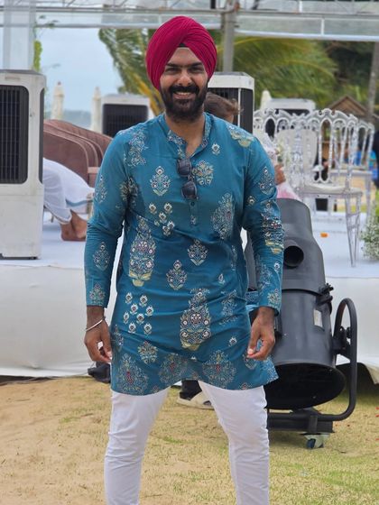 Sporting a traditional kurta for a daytime wedding event. I always make sure my attire fits the theme and formality of the celebration.