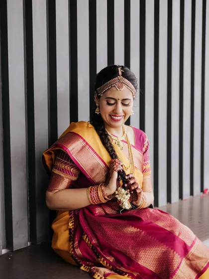 A playful and happy moment, her traditional braid and joyful expression taking center stage.