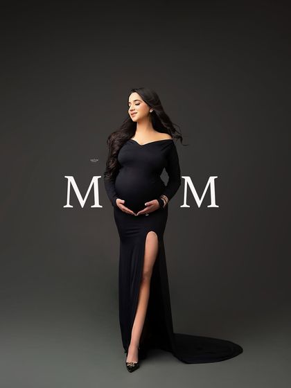 A beautiful full-length portrait of a mamma in a classic black off-the-shoulder gown, with the word "MOM" for a special touch.