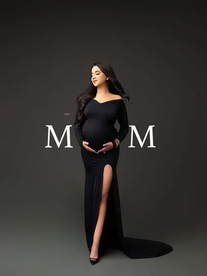 A beautiful full-length portrait of a mamma in a classic black off-the-shoulder gown, with the word "MOM" for a special touch.