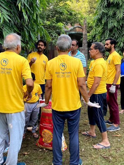 Our community members working together during a cleanliness drive, showing that our practice of yoga extends to selfless service (seva).
