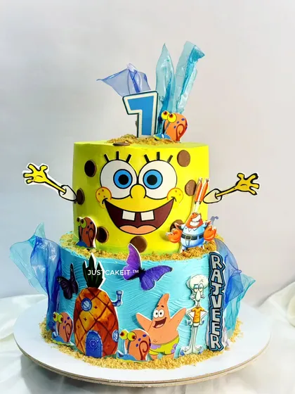 A fun and vibrant two-tiered SpongeBob SquarePants cake. The design captures the underwater world of Bikini Bottom with lots of fun, edible character details.