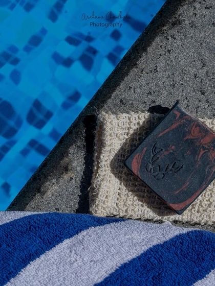 A striking shot of a dark, marbled soap against the bright blue of the pool. The high contrast makes this image particularly eye-catching.