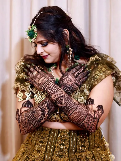 The intricate art of Mehndi is a story in itself. This portrait showcases the bride's beautiful henna, a symbol of love and celebration that I capture with artistic detail and elegance.