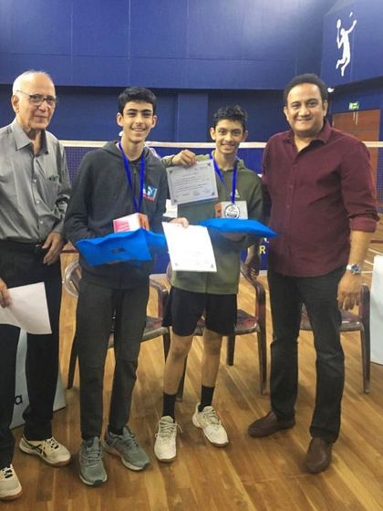 Pravit being awarded his runners-up prize at the Manora badminton tournament. Consistent participation in tournaments is key to building match temperament.