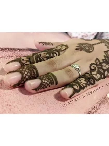 Another angle of the elegant floral vine design, showing how it gracefully covers the side of the hand and fingers.