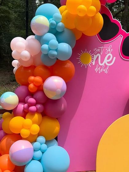 A detailed shot of the colorful balloon garland from the summer-themed party, featuring a mix of bright and pastel shades.