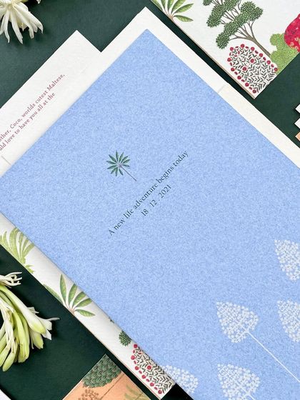 A simple, elegant card in a dusty blue, with a minimalist tree logo. This piece was part of the handmade paper suite, showing how different colors and textures can be combined.