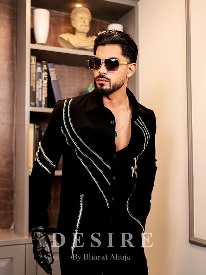 A final look at the black zipper shirt, a piece that redefines elegance with its tailored fit and fierce details.