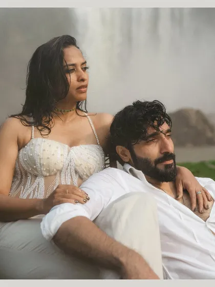 A close-up, editorial-style portrait of Gokul and Vandana from their vow renewal shoot. The intensity in their expressions and the dramatic backdrop create a powerful and memorable image.