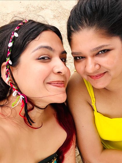 A happy selfie with my cousin on the beach. Our casual and colorful outfits reflect the fun and relaxed vibe of our Goa vacation.