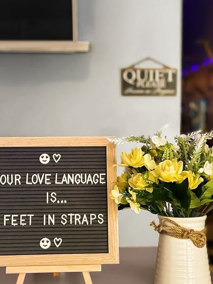 Our love language is 'feet in straps'. It is one of our favorite ways to help you align, stretch, and strengthen.