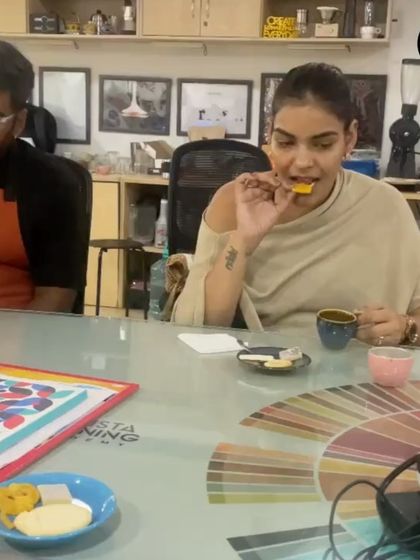 Trying out a cookie with a cup of coffee. This hands-on tasting helps participants understand the principles of flavor pairing.