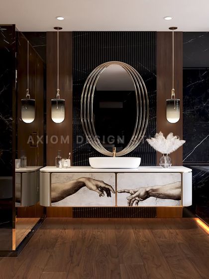 Elegance meets edge in this dark luxury washroom. The vanity features a custom art print on the drawers, an oval mirror, and gradient pendant lights, all set against a backdrop of black marble and wood.