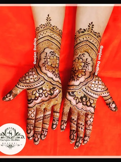 A gorgeous floral design on the back of the hand. The use of negative space makes the flowers appear as if they are floating on the skin.