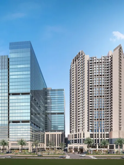A full view of our mixed-use development in Airoli, showcasing the distinct architectural languages of the glass commercial tower and the stone-clad residential building. The design creates a vibrant urban hub for living and working.