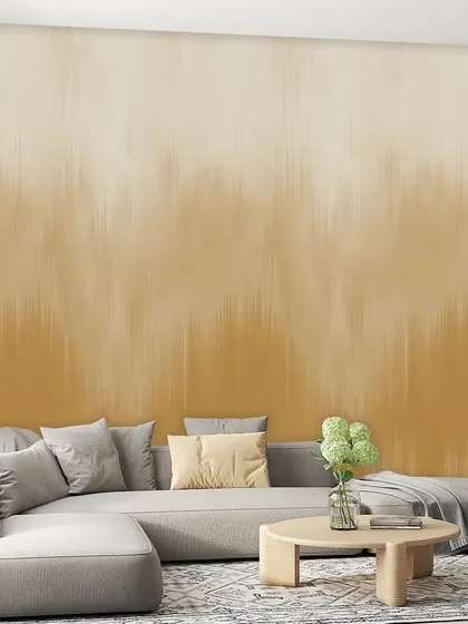 This sandy beige ombre wallcovering features a dripping paint effect, adding a unique artistic texture to the wall. It provides a sophisticated and contemporary backdrop.