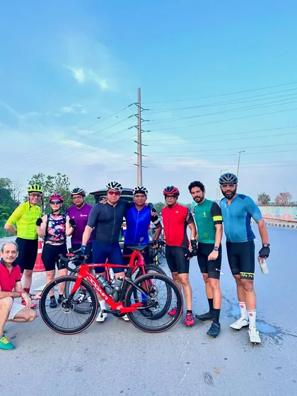 A group of friends posing for a photo after a successful ride.