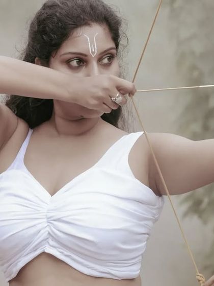 A female warrior concept shoot. These images showcase dynamic action poses, including mid-air shots with a bow and arrow, and serene moments with a horse, all set against a dramatic, smoky backdrop.