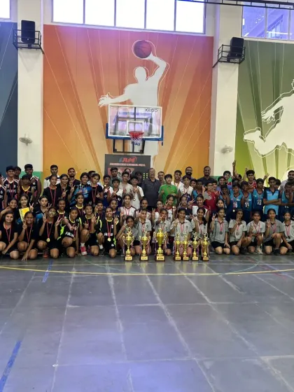 A huge group photo celebrating the winners of the U-14 District Basketball Championship. The sheer number of medals and trophies shows the depth of talent we nurture.