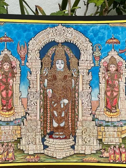 This exquisite Mysore painting features the divine trio of Lord Balaji, Lakshmi, and Padmavathi. This unique artwork is a must-have for any art lover.