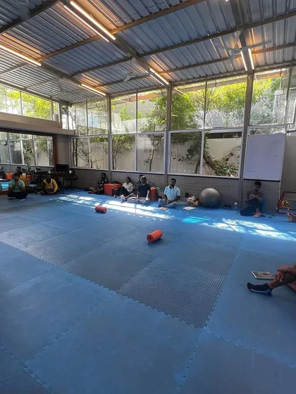 A wide view of one of our monthly wellness sessions. The entire team, including coaches and staff, participates to build trust, unity, and positive energy.