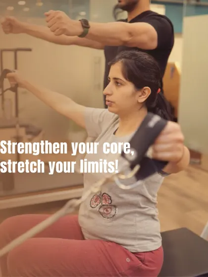 This client is working on the Pilates Chair, a piece of equipment excellent for building upper body and core strength. My guidance ensures she maintains form while stretching her limits.
