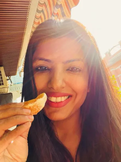 Enjoying winter sunshine with an in-season orange. This simple pleasure combines the mood-boosting effects of sunlight with a dose of immune-boosting Vitamin C.