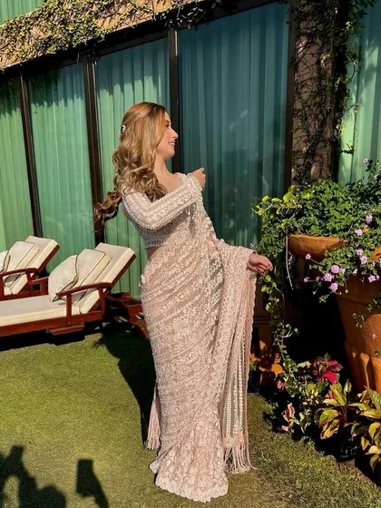 A beautiful shot of my client enjoying the golden hour. Her soft, sun-kissed waves were styled for a natural yet glamorous look, perfect for a bridesmaid or sister of the groom.