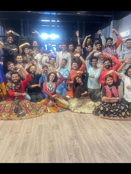 The entire group from a weekend Garba event, all smiles. The spacious layout ensures that even with a large number of participants, everyone feels included and has room to dance.