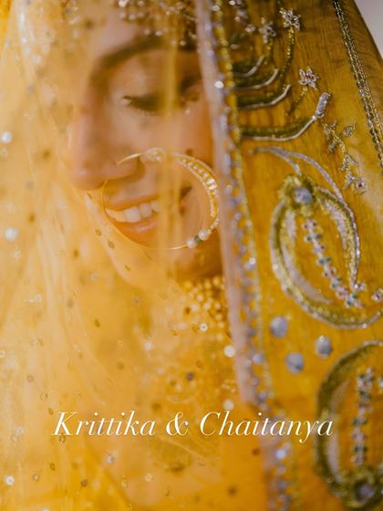A close-up of this radiant bride, smiling through her veil. The makeup is soft and natural, letting her happiness shine.