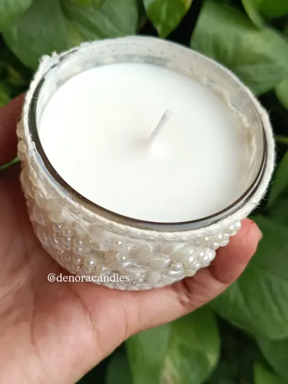 An overhead view of the white lace jar candle, showing the clean soy wax surface.