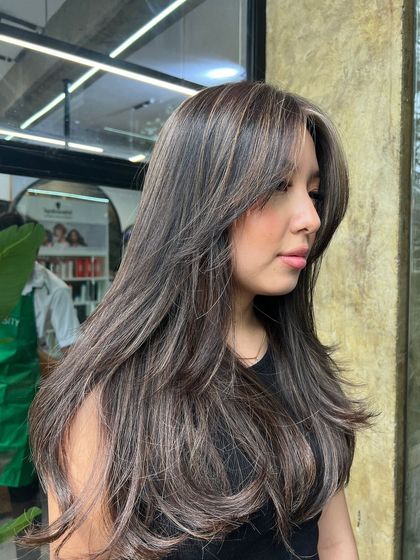 Another angle of this stylish cut and color, highlighting the seamless blend and cool tones.