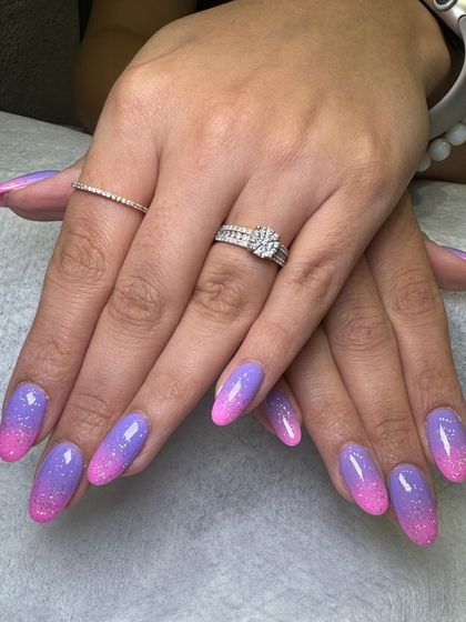 The finished look of this custom art dip powder set. The colors are vibrant, the glitter is sparkling, and the finish is perfectly smooth and durable.