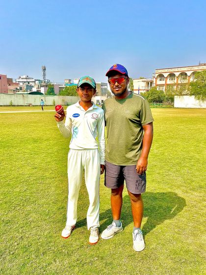 Shatrudhan with his coach after an impressive 5-wicket haul.