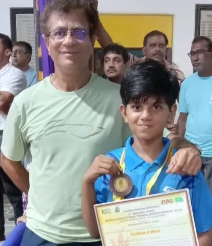 My coaching is for everyone who is serious, from young beginners to seasoned pros. Here I am with my student Riyanshi Goswami after she won a medal at the Bengal State Championship in the U-11 category. Seeing my young players succeed is a great joy.