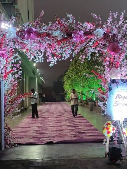 The beautiful floral entrance archway for a wedding at Devanshi Inn, Kalamboli. This grand entrance sets a luxurious tone for the event.